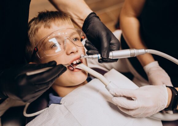 Little boy patient at dentist Pediatric Root Canal Treatment